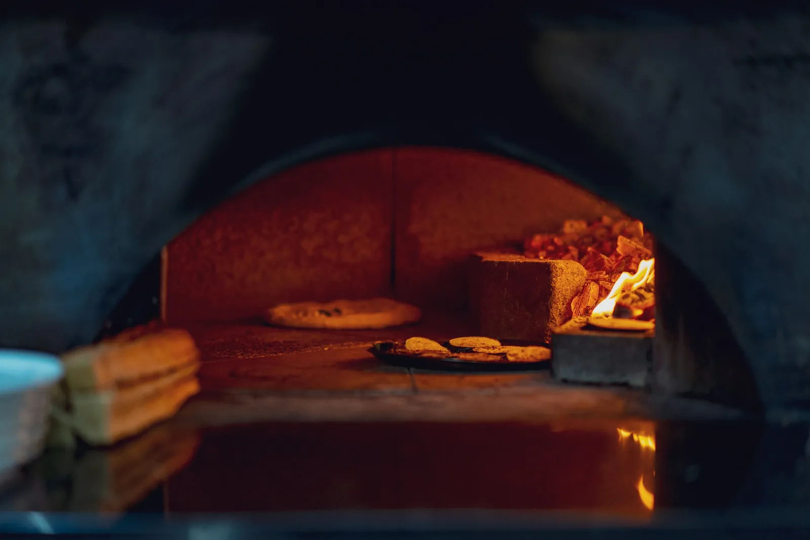 Pide baking inside the stone oven