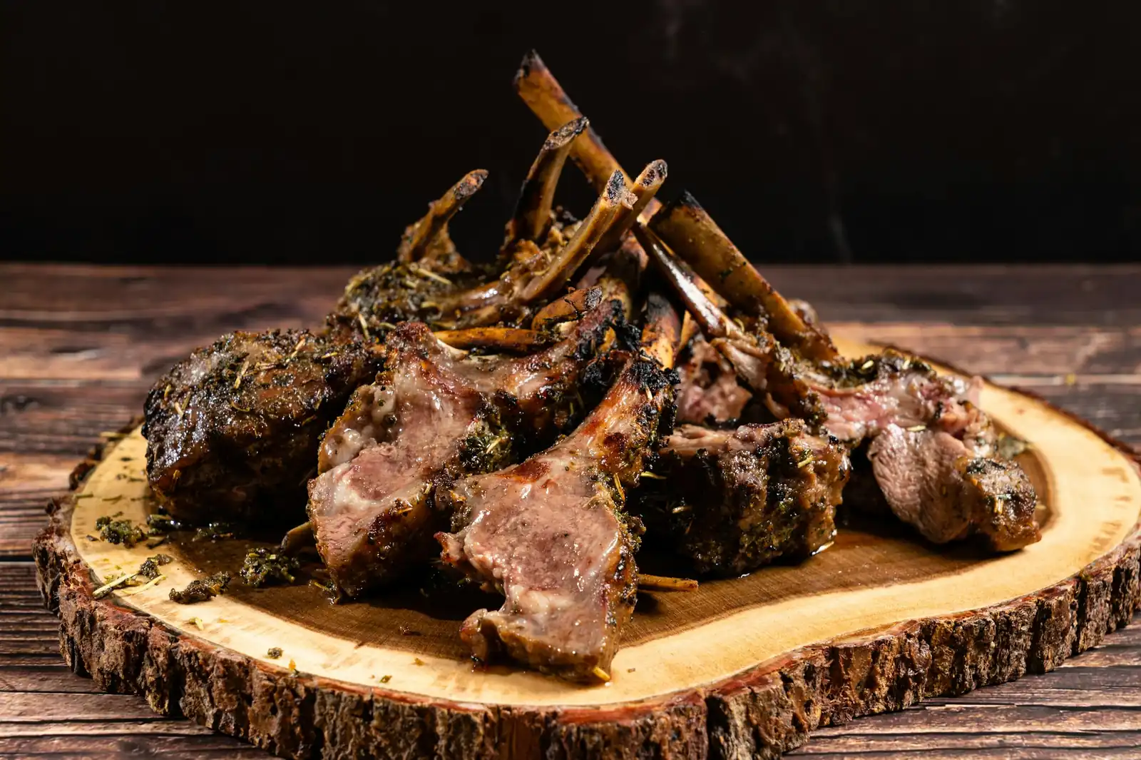 Grilled lamb chops on a wooden board